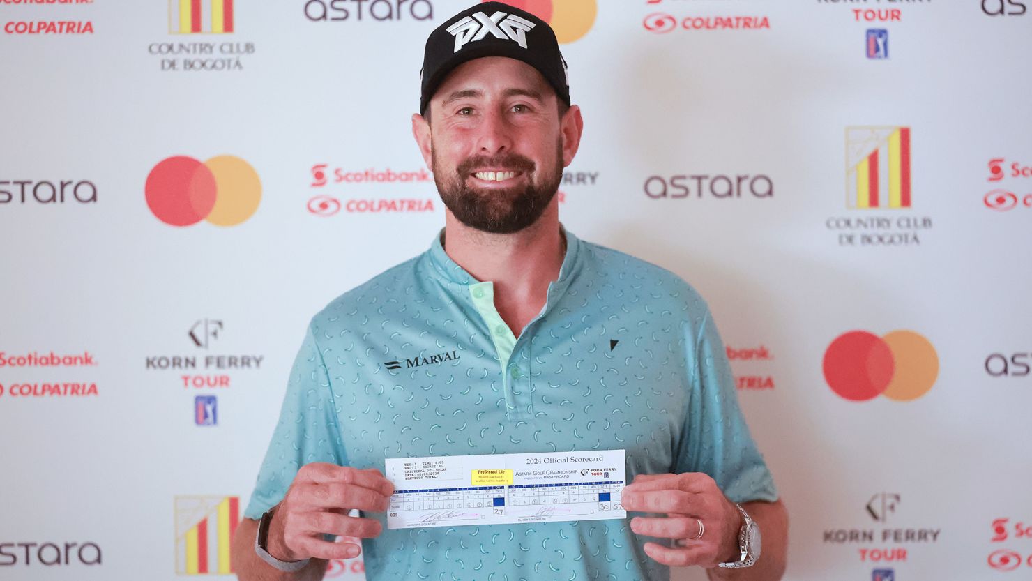 Cristóbal Del Solar holds his official scorecard after shooting 57 during the first round of the 2024 Astara Golf Championship at Country Club de Bogotá in Colombia.