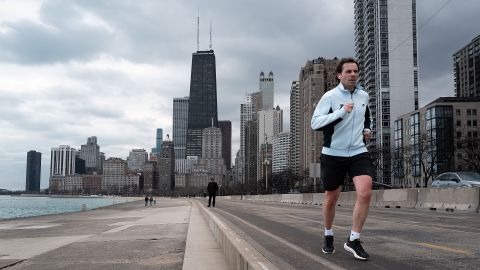 CHICAGO, ILLINOIS - FEBRUARY 08: A jogger runs along Lake Michigan as temperature climbed to near 60 degrees, more than 20 degrees above normal on February 08, 2024 in Chicago, Illinois. The warmer-than-usual day came on the same day that Scientists announced the world surpassed a key warming threshold across an entire year for the first time on record. (Photo by Scott Olson/Getty Images)