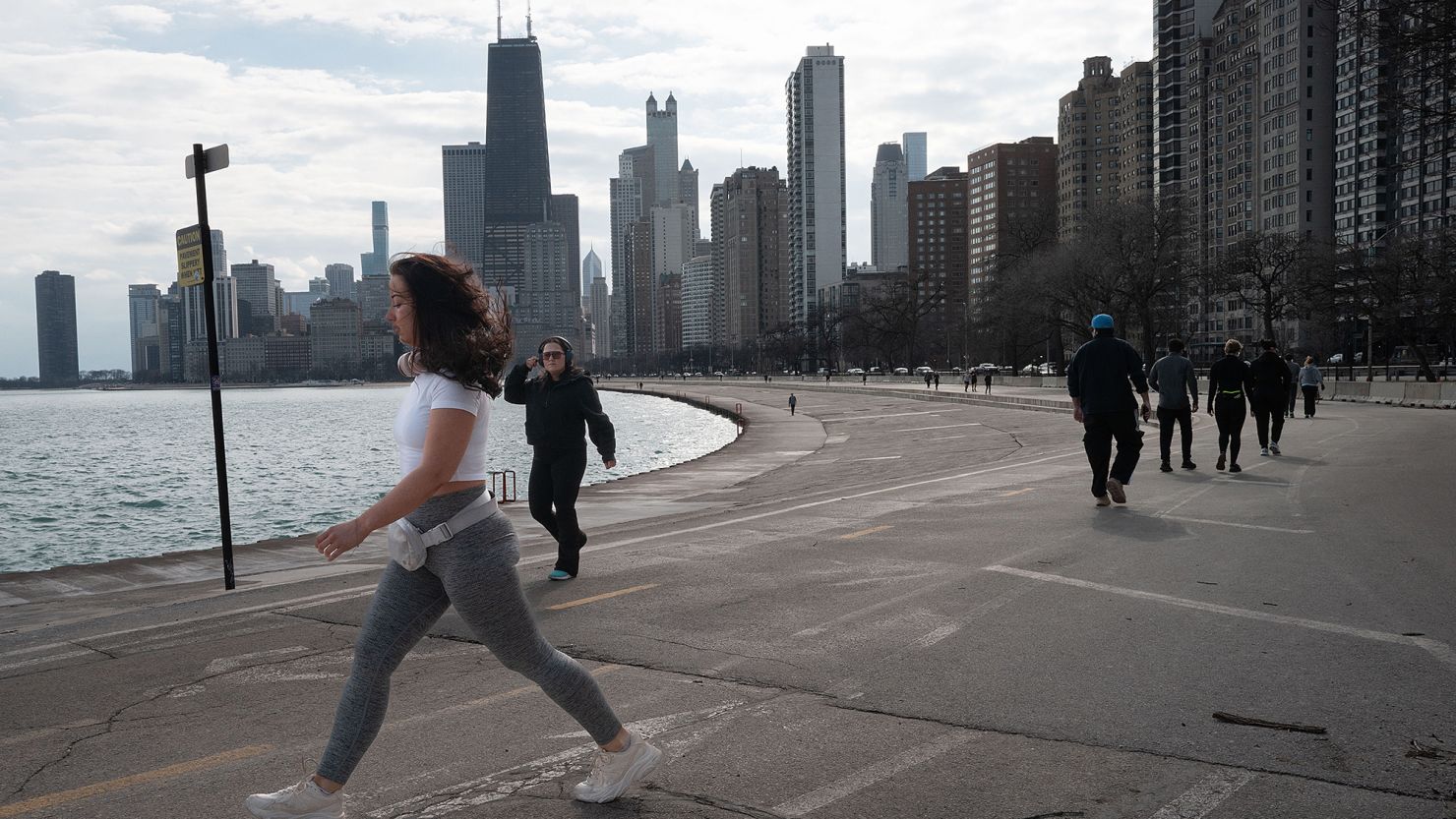 People walk along the Chicago lakefront during an unseasonably warm day on February 8.