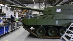 A combat vehicle sits in a factory of German arms manufacturer Rheinmetall in Unterluess, Germany in February 2024. The site is due to start production in 2025.