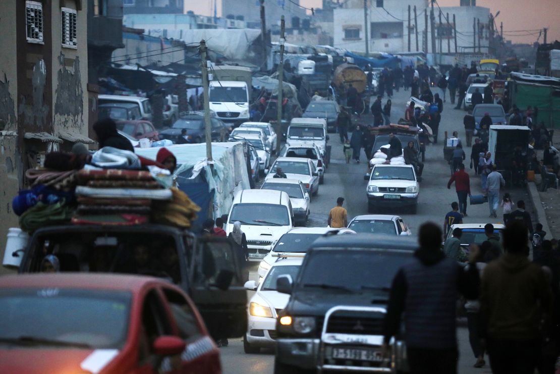 A view of a street, filled with cars, as Palestinians migrate towards Deir al-Balah city with few belonging, they could take with themselves, on a truck due to ongoing and intensified Israeli attacks on Rafah, in Deir al-Balah, Gaza on February 13, 2024.