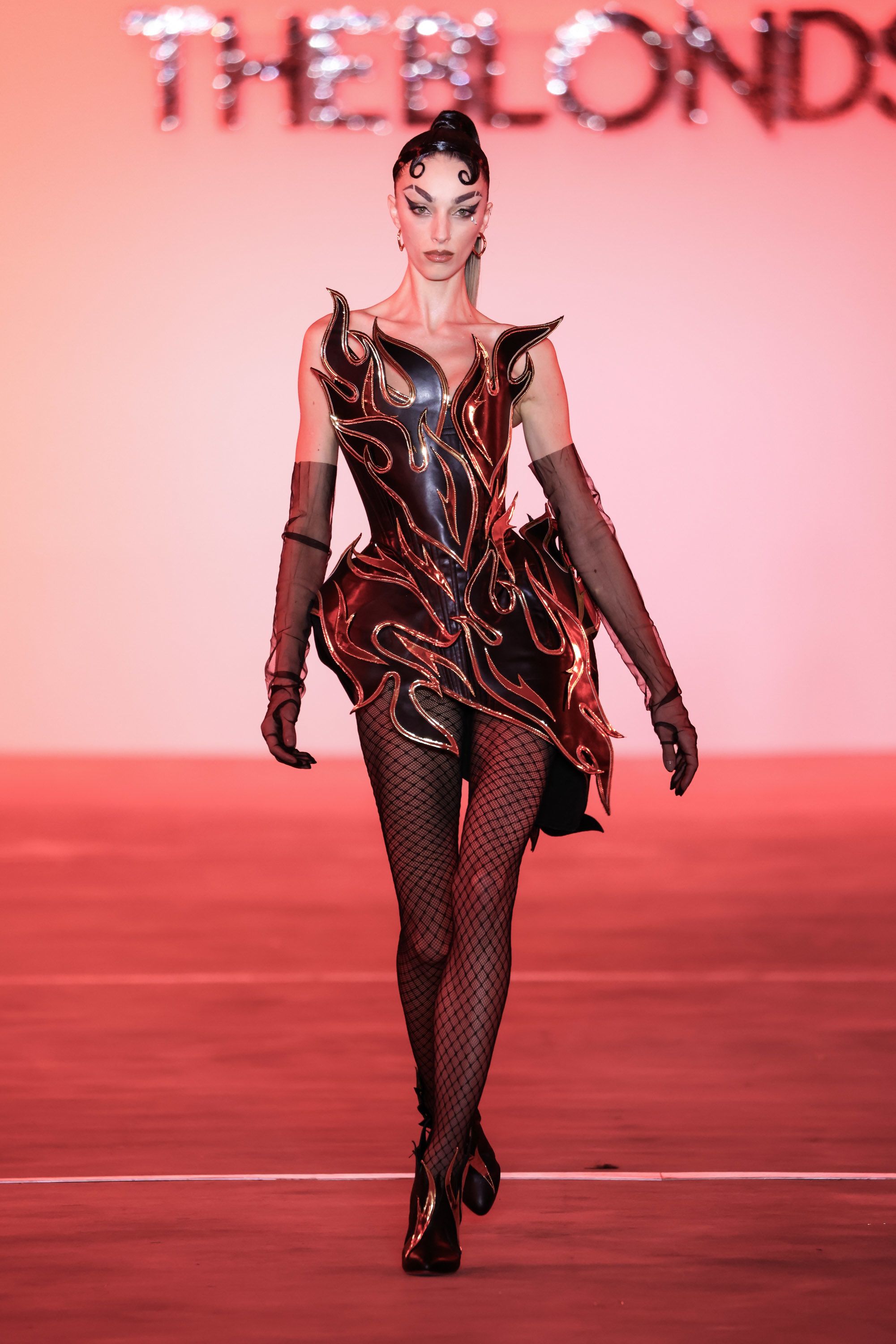 Across lustrous textiles, sparkling jewels and sinuous silhouettes, the collection showcased fire as an embodiment of 