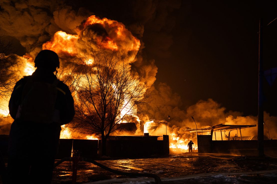 Firefighters extinguish a fire at an oil depot after a Russian suicide drone attack in Kharkiv, Ukraine, in February 2024.