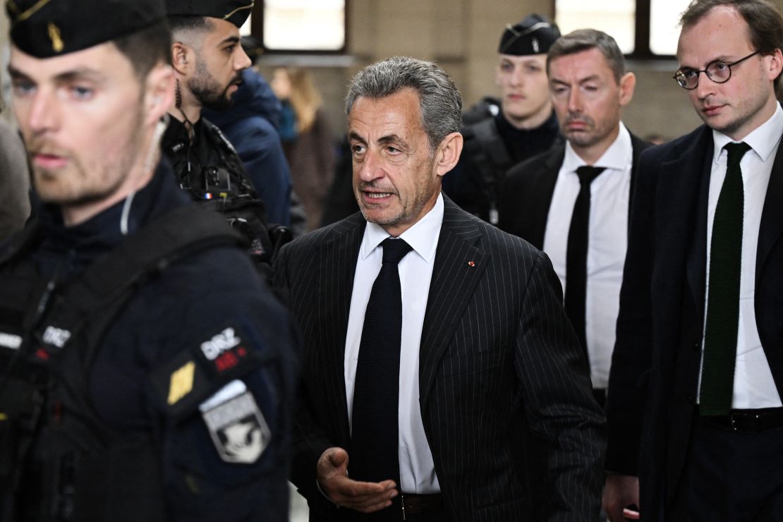 France's former president Nicolas Sarkozy (C) arriving at a Paris court for the verdict in his appeal trial in the so-called Bygmalion case in February.