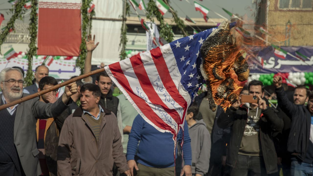 A U.S. flag is set on fire during the annual rally commemorating Iran's 1979 Islamic Revolution in Tehran, Iran, Sunday, Feb. 11, 2024. Iran marked Sunday the 45th anniversary of the 1979 Islamic Revolution amid tensions gripping the wider Middle East over Israel's continued war on Hamas in the Gaza Strip.