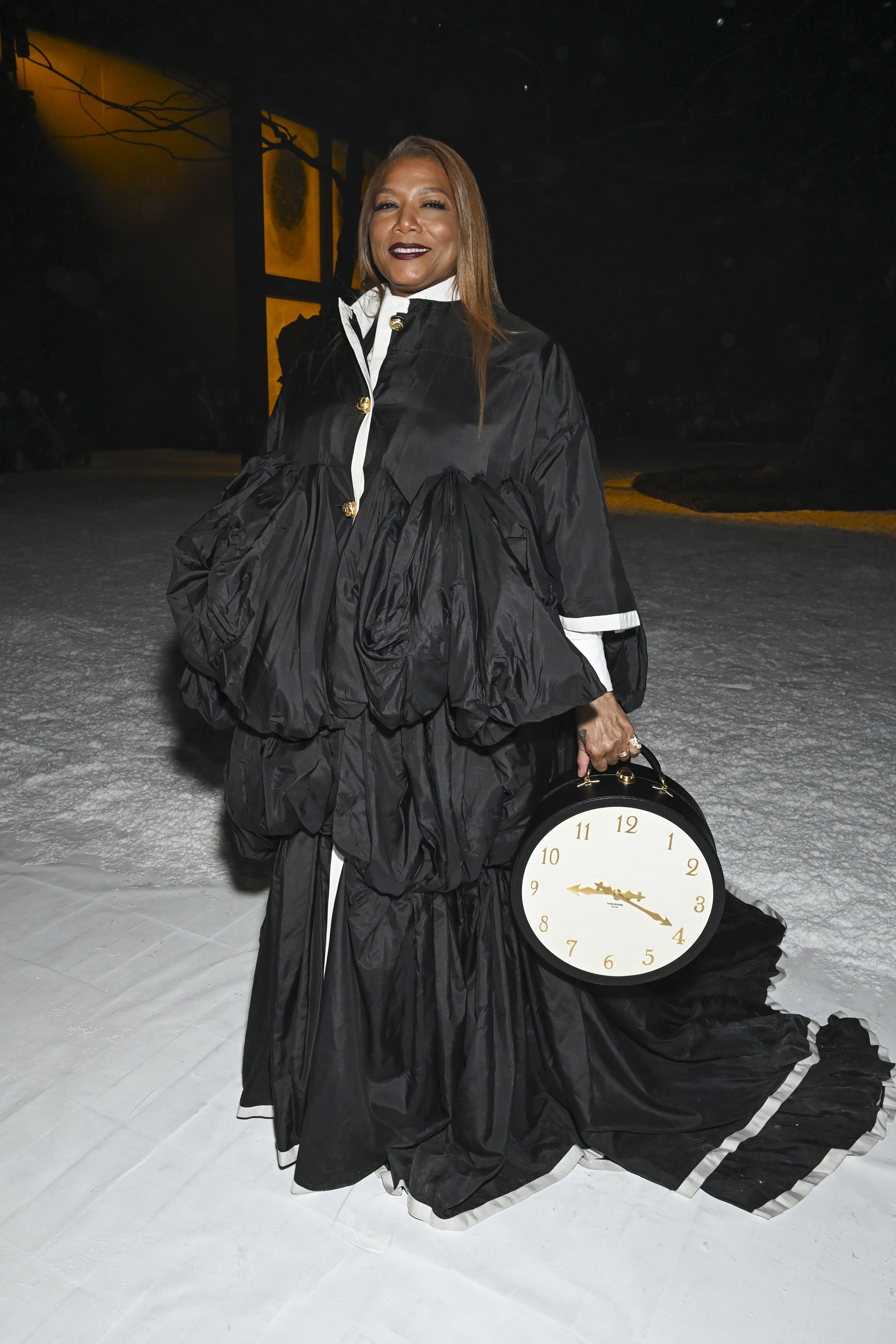 Queen Latifah attends the Thom Browne runway show on February 14.