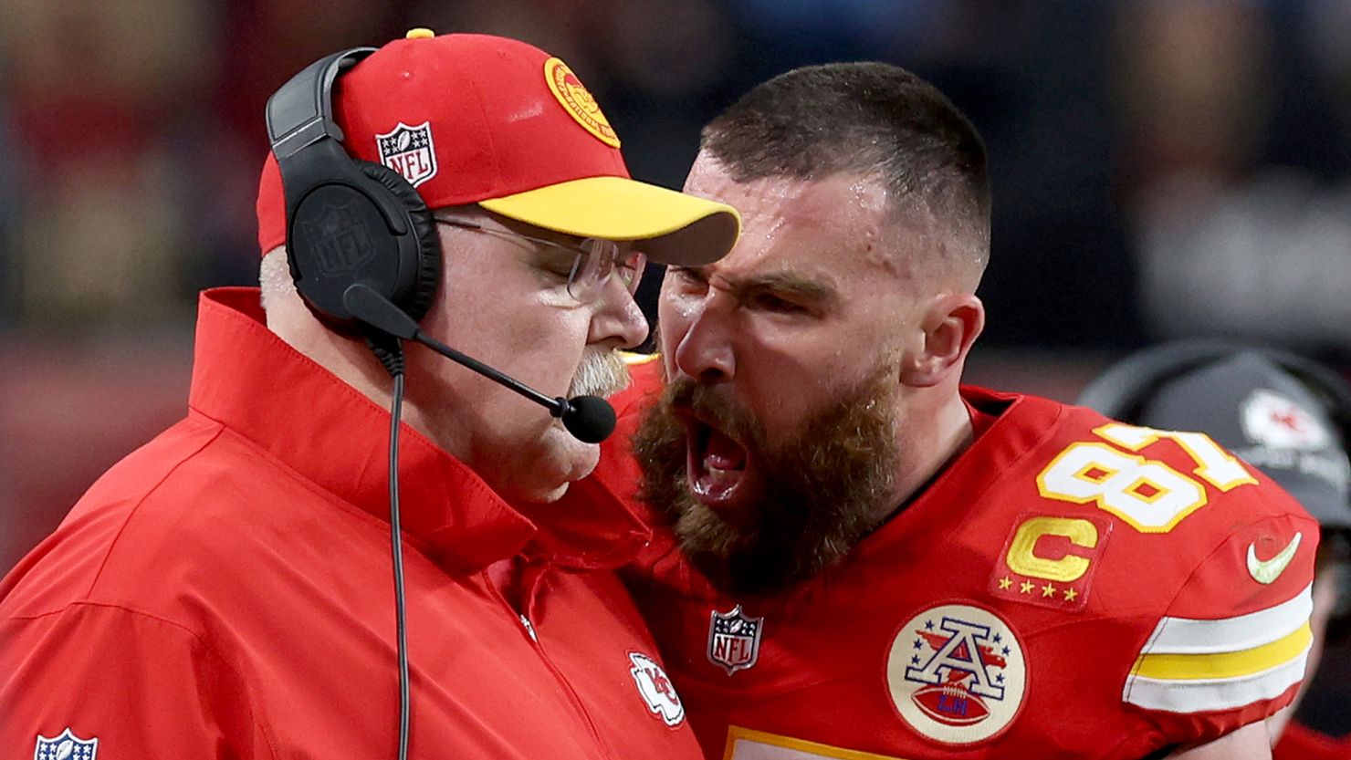 Travis Kelce shouts at head coach Andy Reid on the sideline during Super Bowl LVIII.