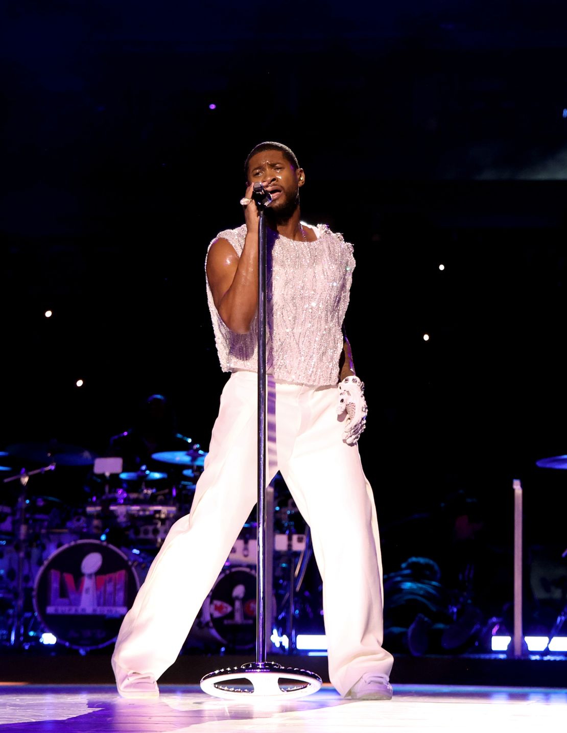 Usher performs in a crystal-encrusted D&G vest.