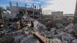 People inspect the damage to their homes following Israeli air strikes on February 12, in Rafah, Gaza.