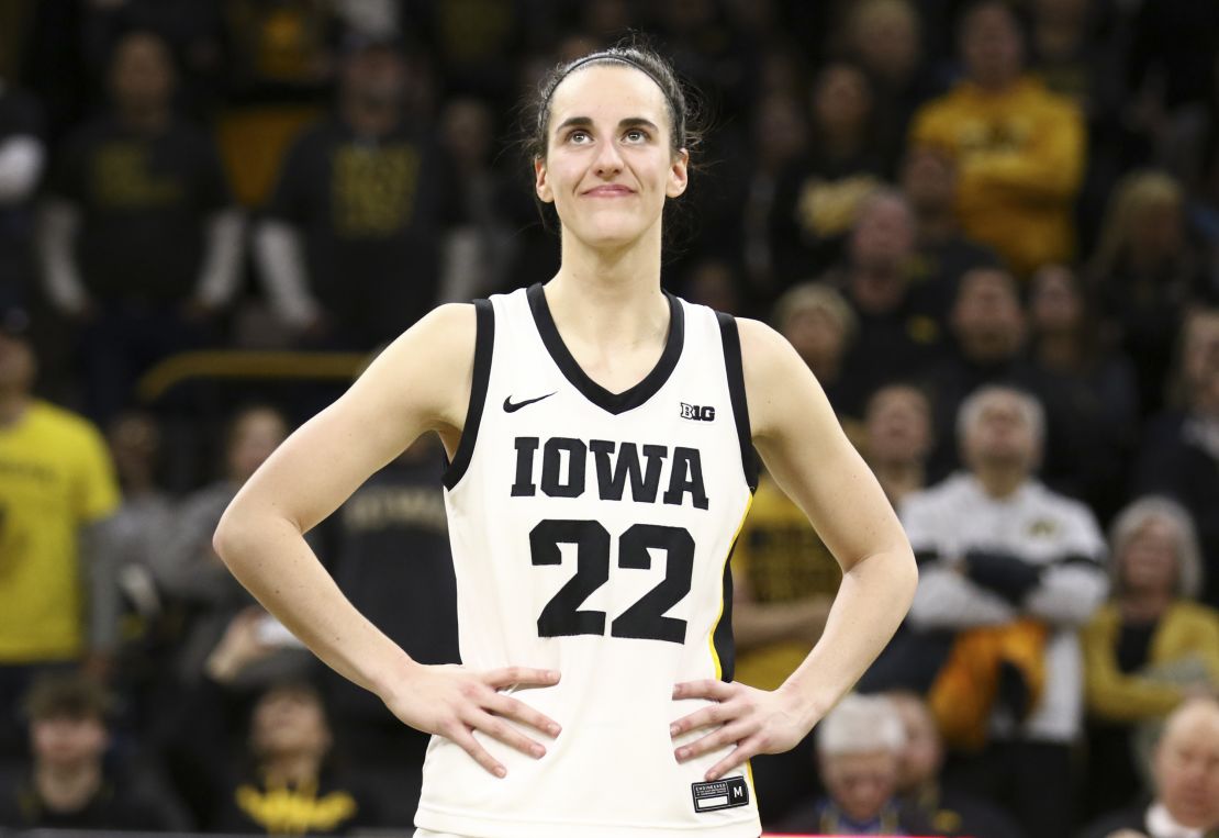 Clark listens as the crowd cheers after breaking the NCAA women's all-time scoring record during Iowa's game against Michigan at Carver-Hawkeye Arena on February 15.