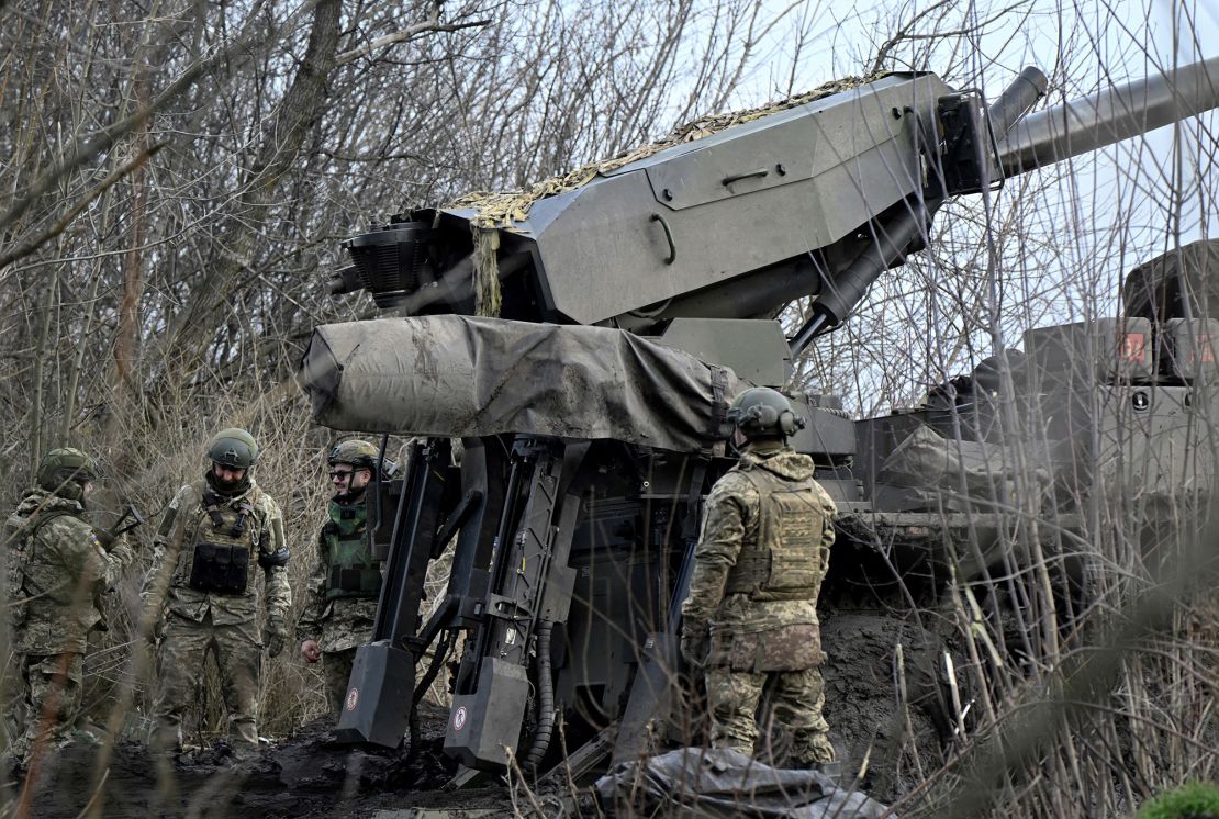 Ukrainian servicemen of the Air Assault Forces prepare to fire a 155mm Caesar 8x8 wheeled self-propelled howitzer on a front line in an undisclosed location, southern Ukraine, on February 14, 2024.