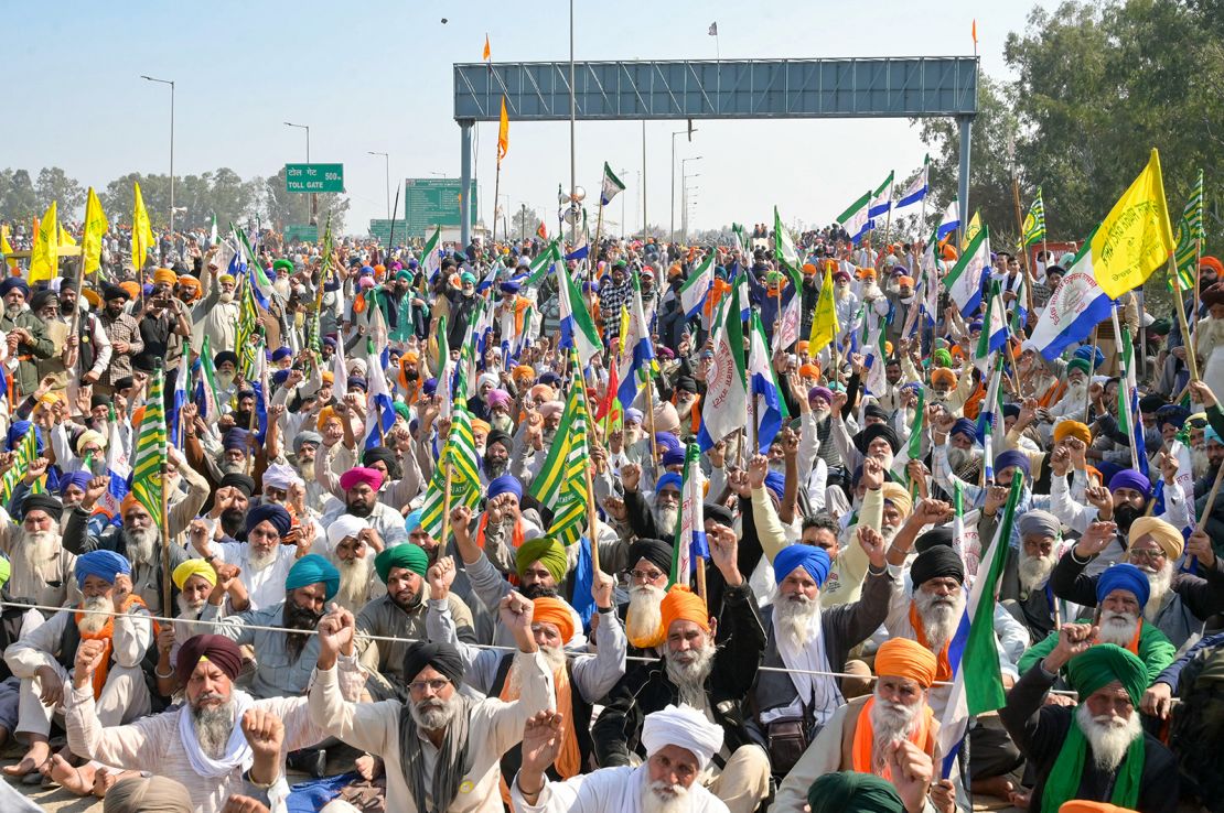 Farmers shout slogans during a protest to demand minimum crop prices, near the Haryana-Punjab state border at Shambhu in Patiala district about 200 kilometres north of New Delhi on February 16, 2024.