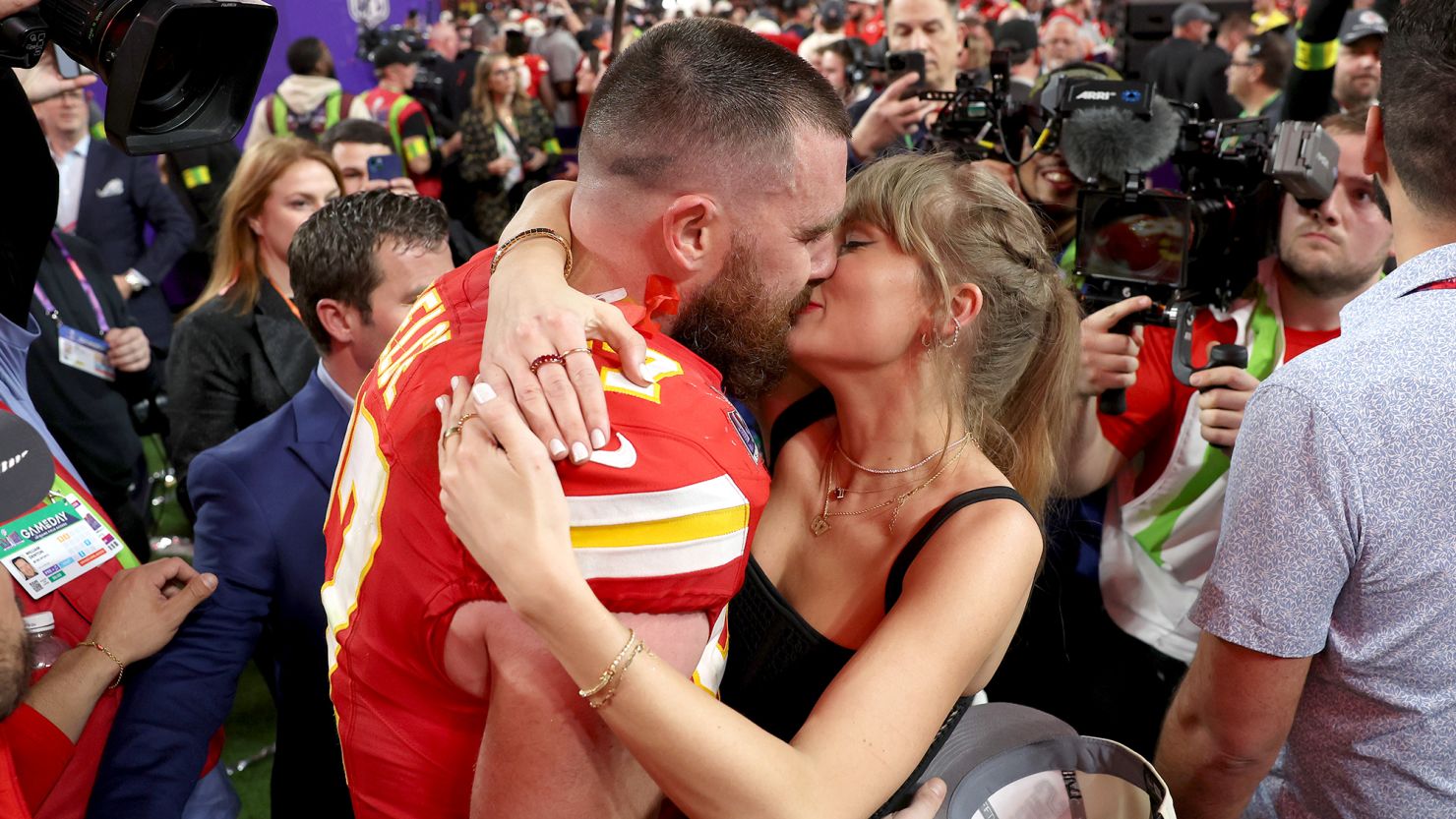Travis Kelce #87 of the Kansas City Chiefs and Taylor Swift embrace after defeating the San Francisco 49ers in overtime during Super Bowl LVIII at Allegiant Stadium on February 11, 2024, in Las Vegas, Nevada.