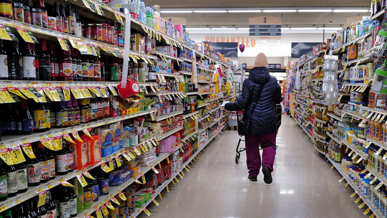 A customer shops at a grocery store on February 13 in Chicago.