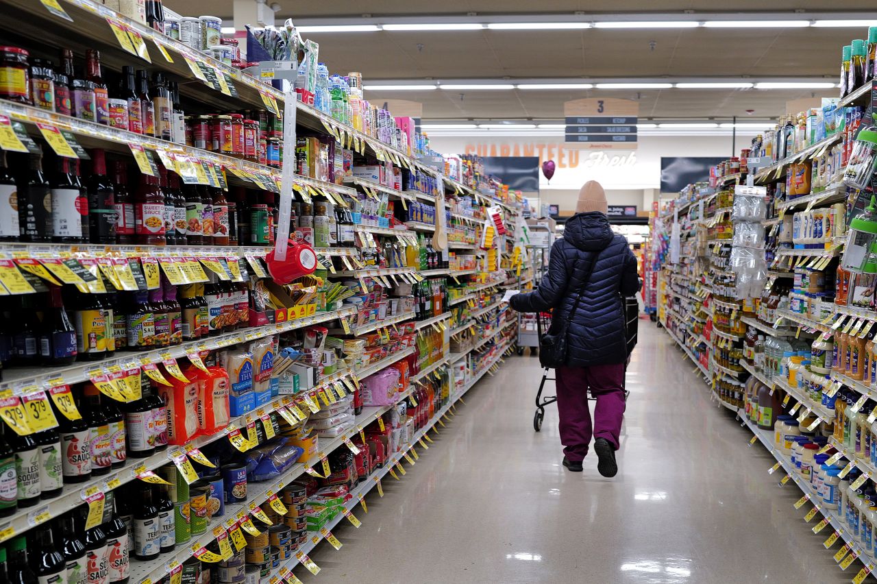 A customer shops at a grocery store on February 13 in Chicago.