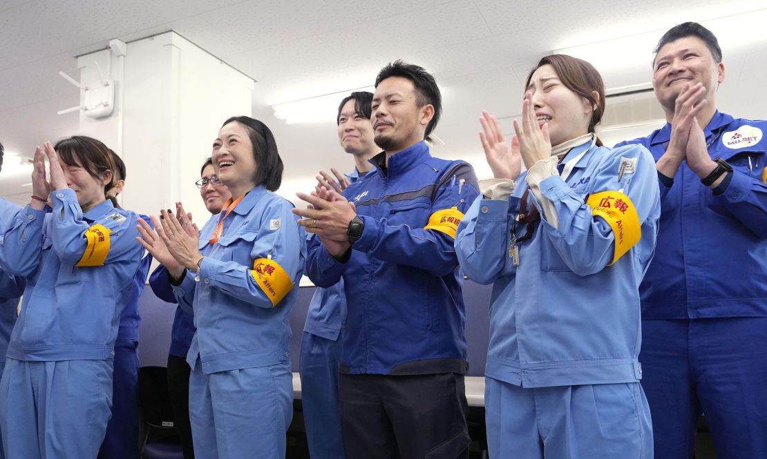 Officials of the Japan Aerospace Exploration Agency and Mitsubishi Heavy Industries Ltd. celebrate after two functioning microsatellites were detached from Japan's No. 2 H3 rocket following its lift-off from the Tanegashima Space Center in Minamitane, Kagoshima Prefecture, southwestern Japan, on Feb. 17, 2024. (Photo by Kyodo News via Getty Images)