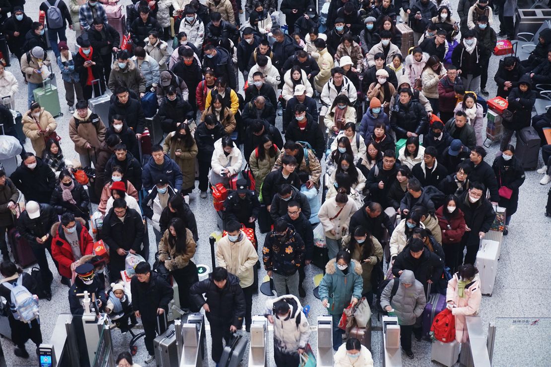 Passengers at Hangzhou East Railway Station in China's Zhejiang province on February 17, 2024