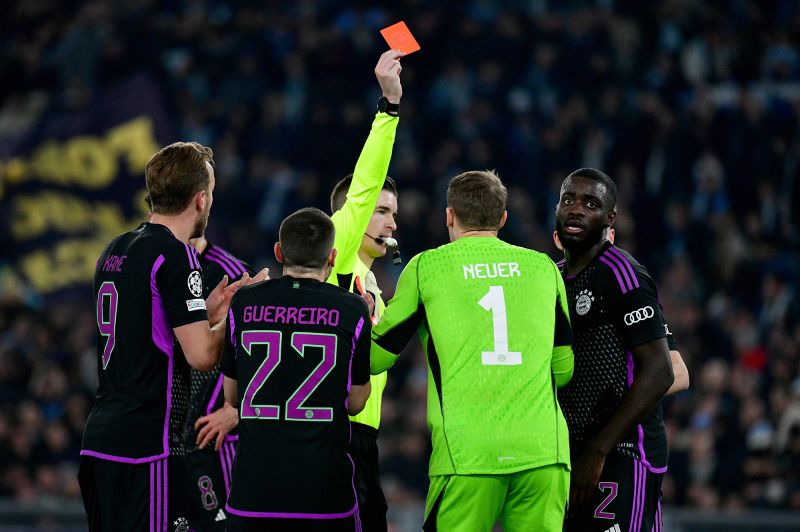 Upamecano (right) is shown a red card against Lazio.