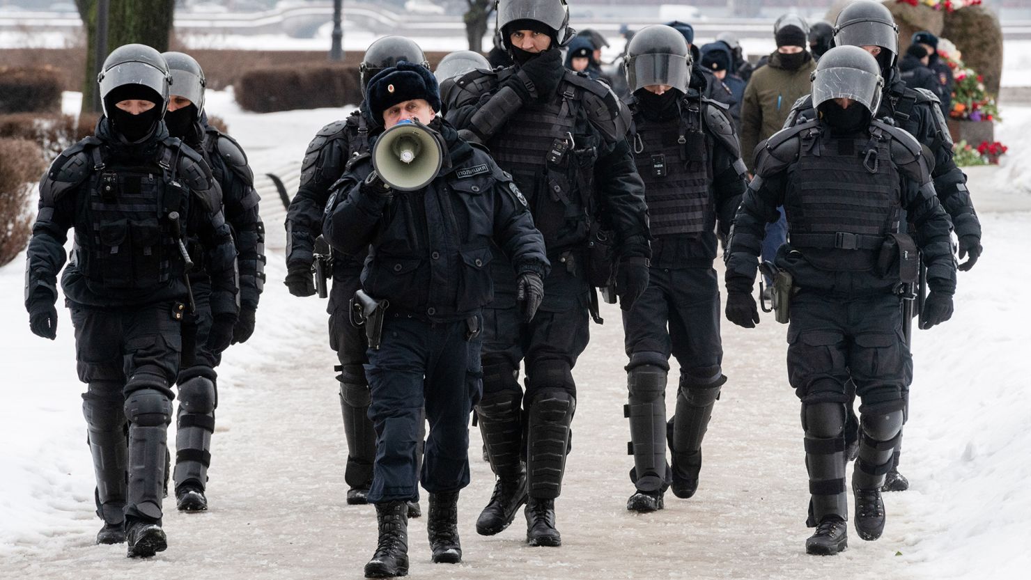 Police block the way to a monument for victims of political repression and Russians tried to mourn opposition leader Alexey Navalny the day after news of his death.