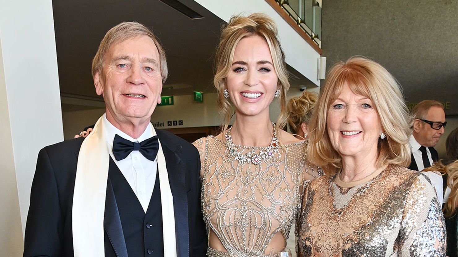 Emily Blunt, center, poses with her parents Oliver Blunt and Joanna Blunt at the EE BAFTA Film Awards 2024 at The Royal Festival Hall on February 18 in London, England.