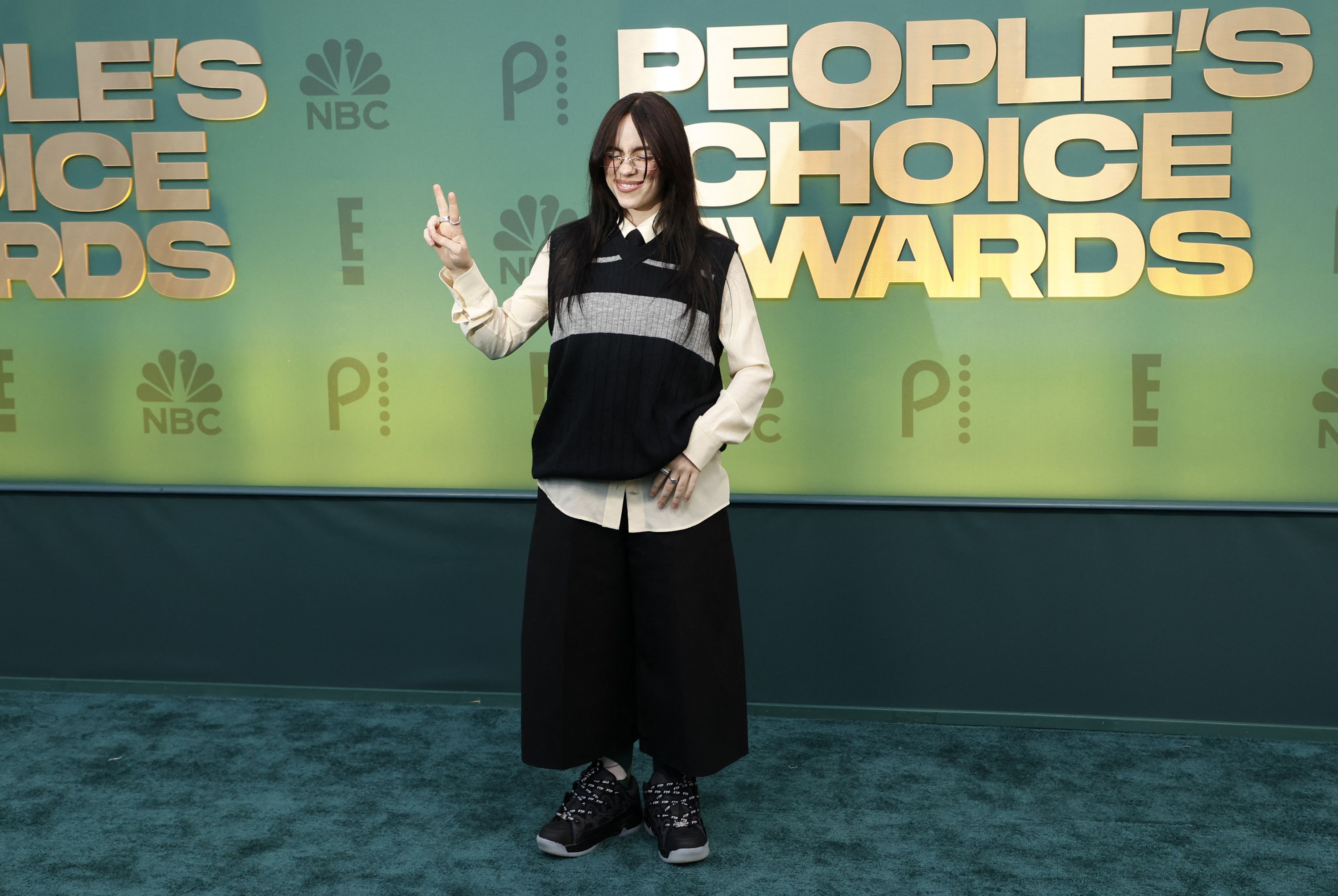 With her hair back to all black, Billie Eilish chose a sweater vest, shirt and tie combo teamed with baggy trousers and chunky shoes. The singer won the "TV Performance of the Year" award for her appearance in "Swarm."