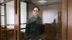 US journalist Evan Gershkovich, arrested on espionage charges, looks out from inside a defendants' cage before a hearing to consider an appeal on his extended pre-trial detention, at the Moscow City Court in Moscow on February 20, 2024. Wall Street Journal reporter Evan Gershkovich was detained last March on spying charges during a reporting trip to the Urals. (Photo by NATALIA KOLESNIKOVA / AFP) (Photo by NATALIA KOLESNIKOVA/AFP via Getty Images)