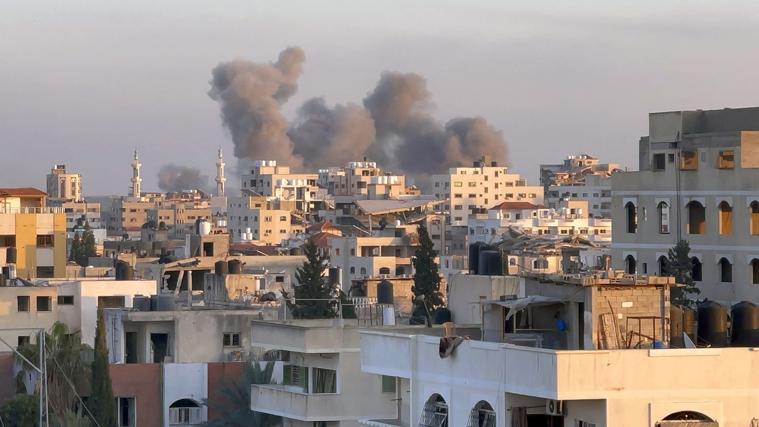 A picture taken in Gaza City shows smoke billowing in the background during Israeli bombardment on February 20, 2024, amid continuing battles between Israel and the Palestinian militant group Hamas.