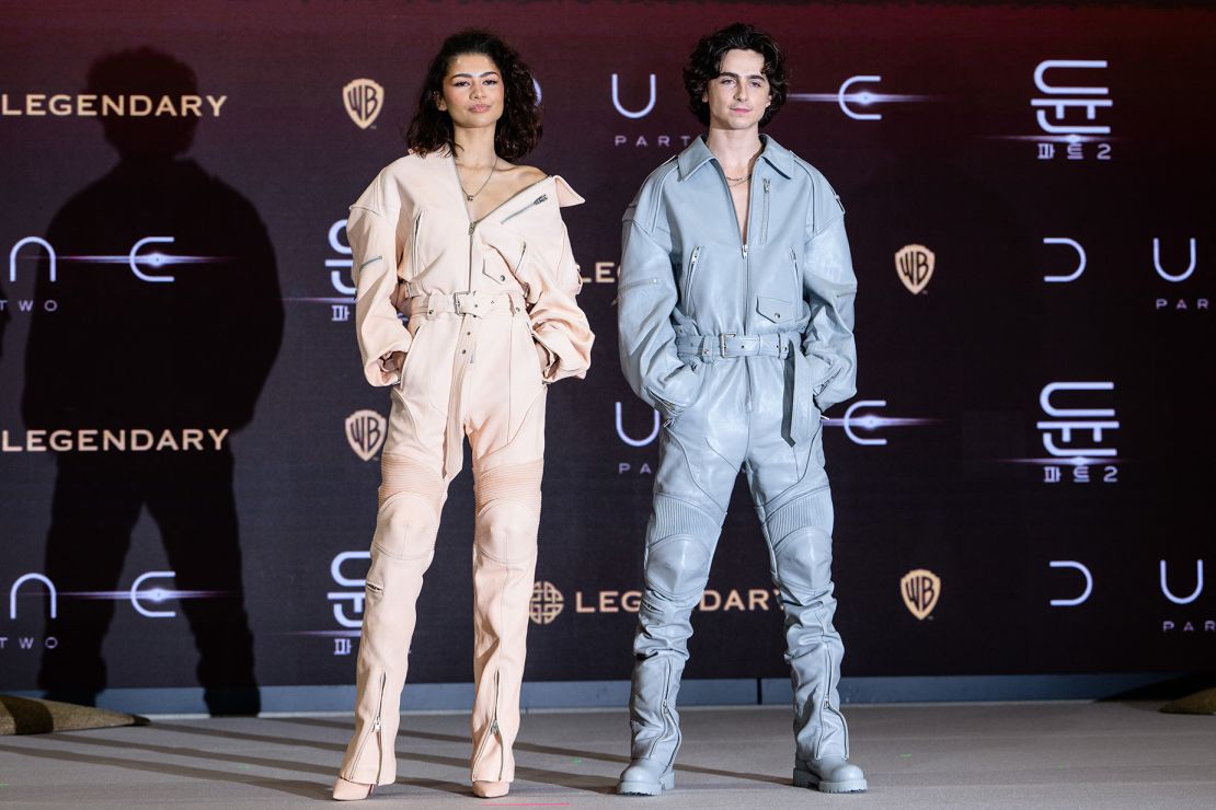 Zendaya and Chalamet — in matching boiler suits designed by Juun. J — attend a press conference in Seoul on February 21.