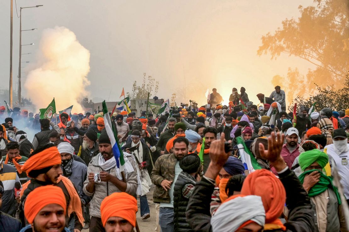 Police fire teargas to disperse farmers marching towards New Delhi during a protest at the Haryana-Punjab state border on February 21, 2024.