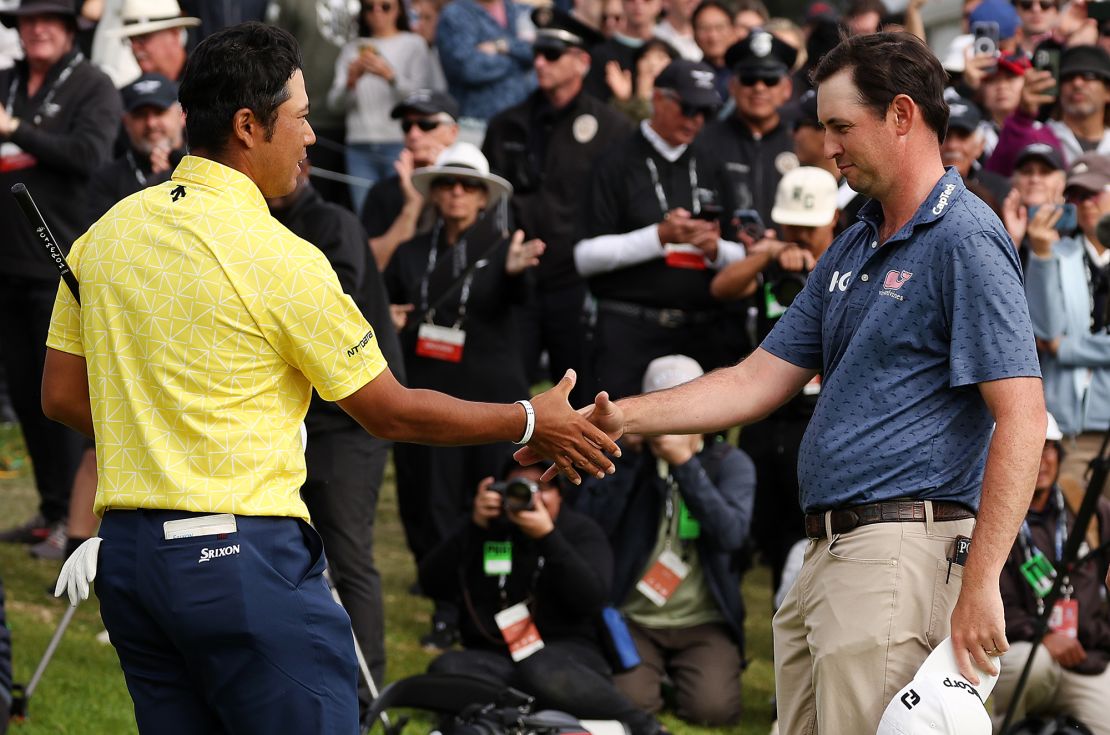 Poston congratulates Matsuyama on a spectacular round.