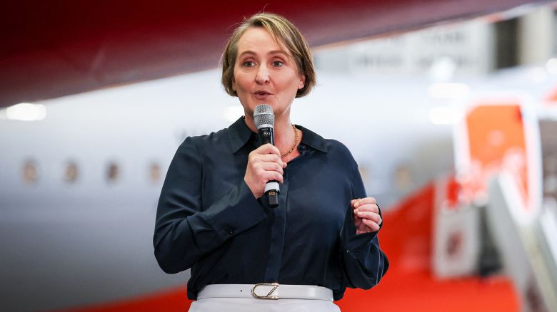 Qantas Airways CEO Vanessa Hudson announces half-yearly earnings in an aircraft hanger at Sydney's Kingsford Smith airport in February 2024.