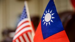 The Taiwanese flag, right, and the American flag in Taipei, Taiwan, on Thursday, Feb. 22, 2024. A delegation of US lawmakers led by Republican Mike Gallagher arrived in Taiwan, a visit that may exacerbate an already fraught relationship between the island and China. Photographer: I-Hwa Cheng/Bloomberg via Getty Images