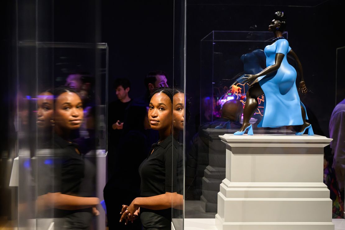 Tschabalala Self stands with a scale model of her work "Lady in Blue" at the announcement of the shortlist for the next Fourth Plinth commission at the National Gallery in London on February 19, 2024.