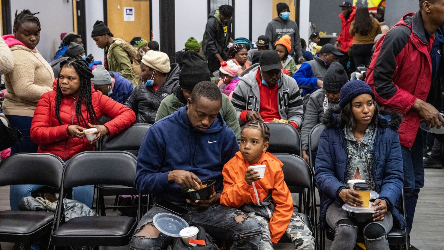 Migrants eat a meal at the La Colaborativa day shelter in Chelsea, Massachusetts, on February 22, 2024. The shelter opened on February 20, and is currently helping about 200 migrants, mainly refugees from Haiti, build resumes, get work, receive health care. The shelter provides day care and food to the migrants and it aims to place migrants outside of Chelsea which is already filled with local migrants. (Photo by Joseph Prezioso / AFP) (Photo by JOSEPH PREZIOSO/AFP via Getty Images)