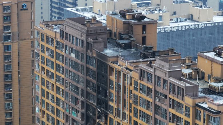 An aerial photo is showing the scene after a fire was extinguished in a residential area in Nanjing, Jiangsu Province, China, on February 23, 2024. In the early morning of the same day, a fire broke out in Building 6 of Mingshang Xiyuan in the Yuhuatai District of Nanjing. More than 20 fire trucks rushed to the scene, and the fire was extinguished around 6 a.m. The fire has resulted in the deaths of 4 people. (Photo by Costfoto/NurPhoto via Getty Images)