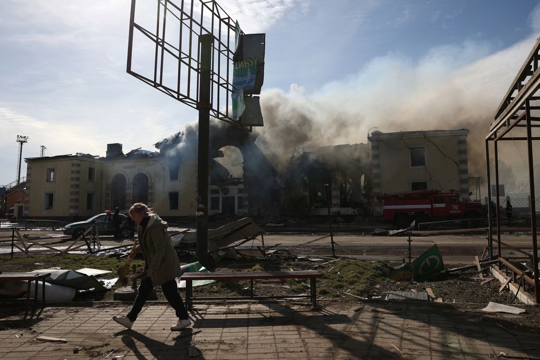 A local resident cleans debris in front of the railway station destroyed by a Russian missile attack in Kostyantynivka, Donetsk region, on February 25, 2024, amid the Russian invasion of Ukraine.