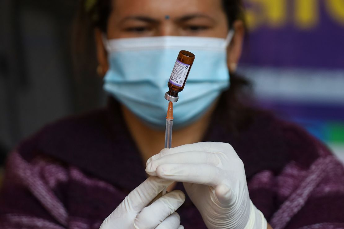 A Nepali paramedic prepares a dose of the measles-rubella vaccine as she gets ready to administer it during a nationwide vaccination campaign in Kathmandu, Nepal, in February.