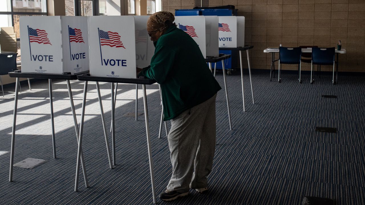 A Michigan voter casts a ballot at a polling station in Detroit on February 25, 2024.