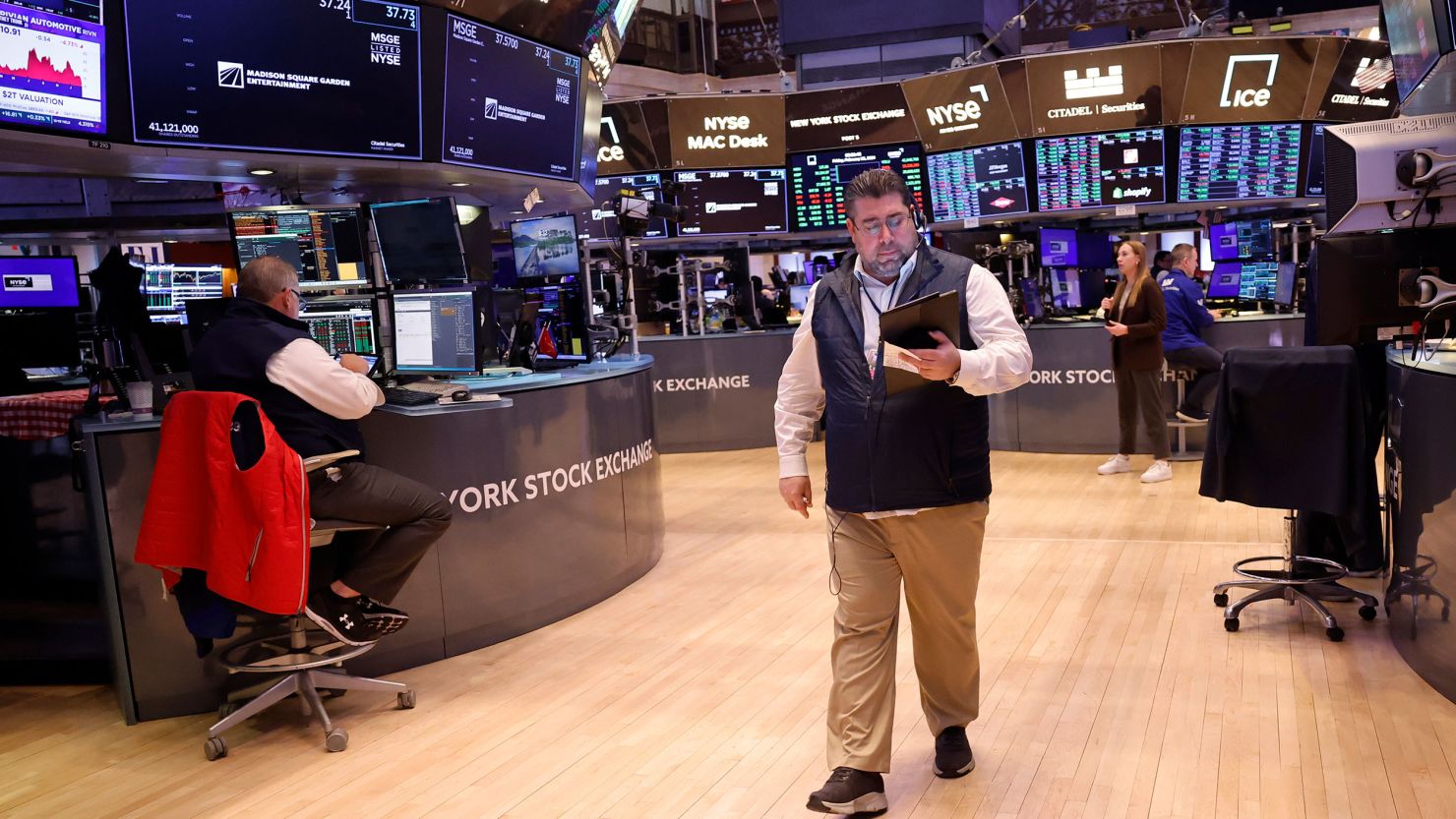 Traders work on the floor of the New York Stock Exchange during morning trading.