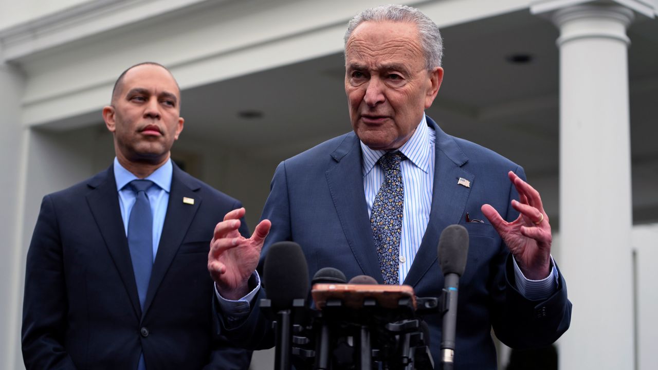 House Minority Leader Hakeem Jeffries, at left, and Senate Majority Leader Chuck Schumer, at right, speak to the media after meeting at the White House in Washington, DC.