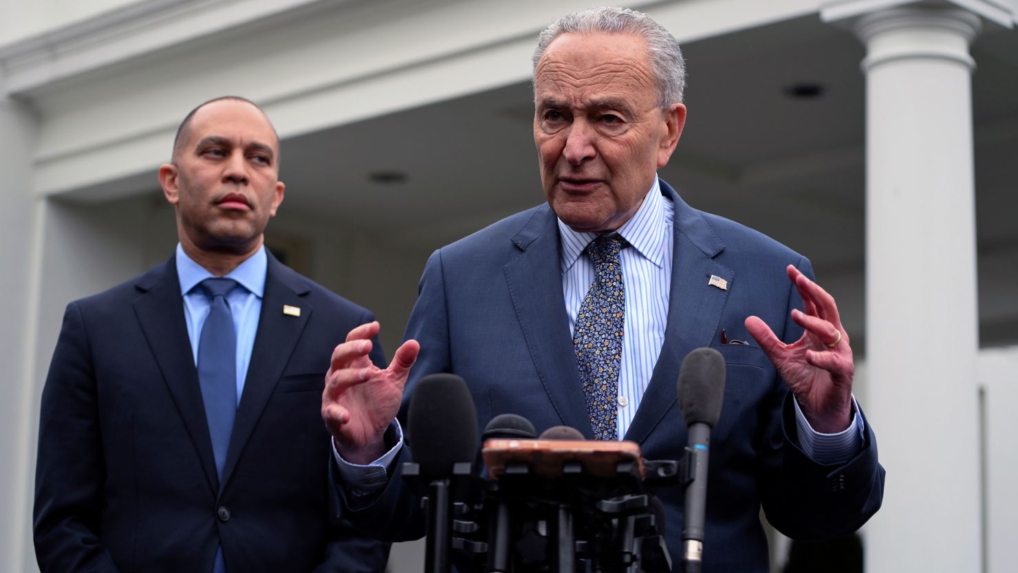 House Minority Leader Hakeem Jeffries, at left, and Senate Majority Leader Chuck Schumer, at right, speak to the media after meeting at the White House in Washington, DC.