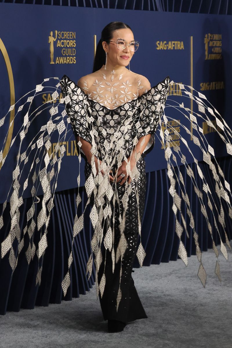 Ali Wong, wearing an ornately-patterned, chandelier-esque gown by Iris van Herpen.