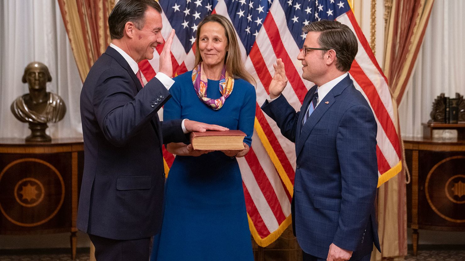U.S. House Speaker Mike Johnson swears in Rep. Tom Suozzi as his wife Helene Suozzi looks on during a ceremony at the U.S. Capitol on February 28, 2024 in Washington, DC.