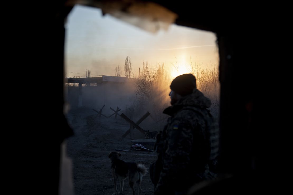 A Ukrainian soldier is seen during sunset in the village of Karlivka, near the Avdiivka frontline.