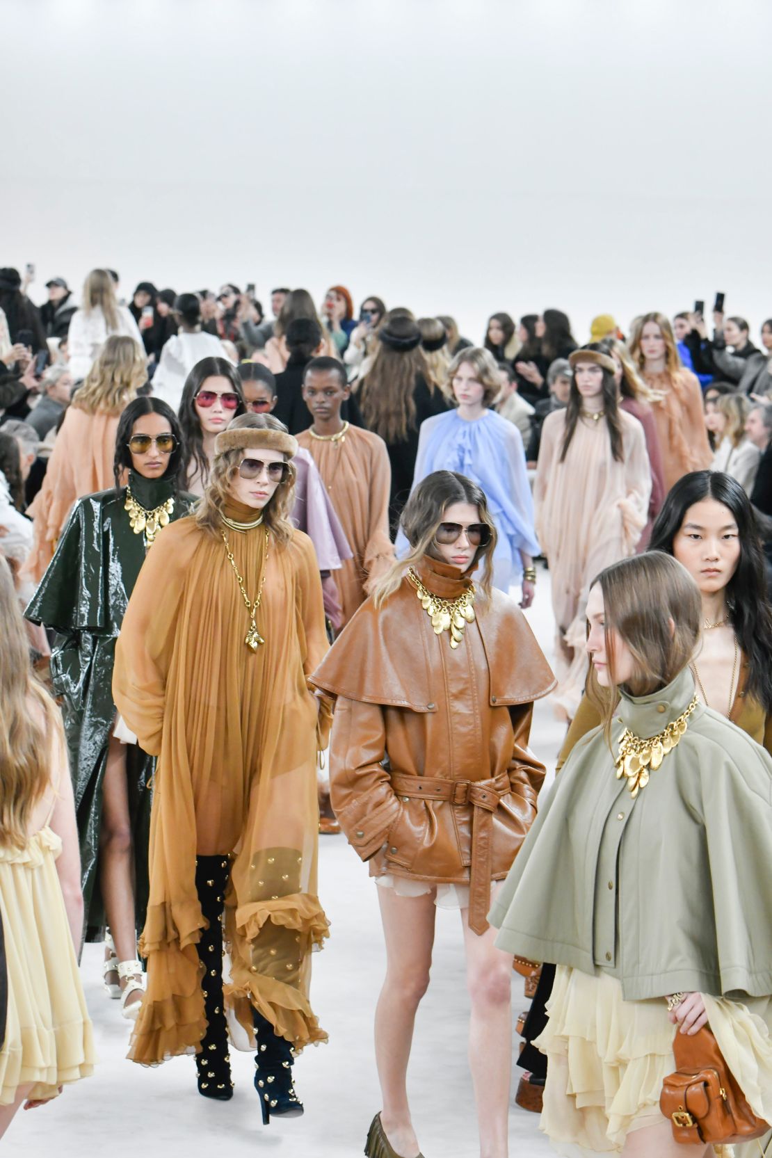 Stockman-style coats in colored, patent and soft leather were everywhere at Chloé, as were thigh-high boots and wafting, chiffon dresses.