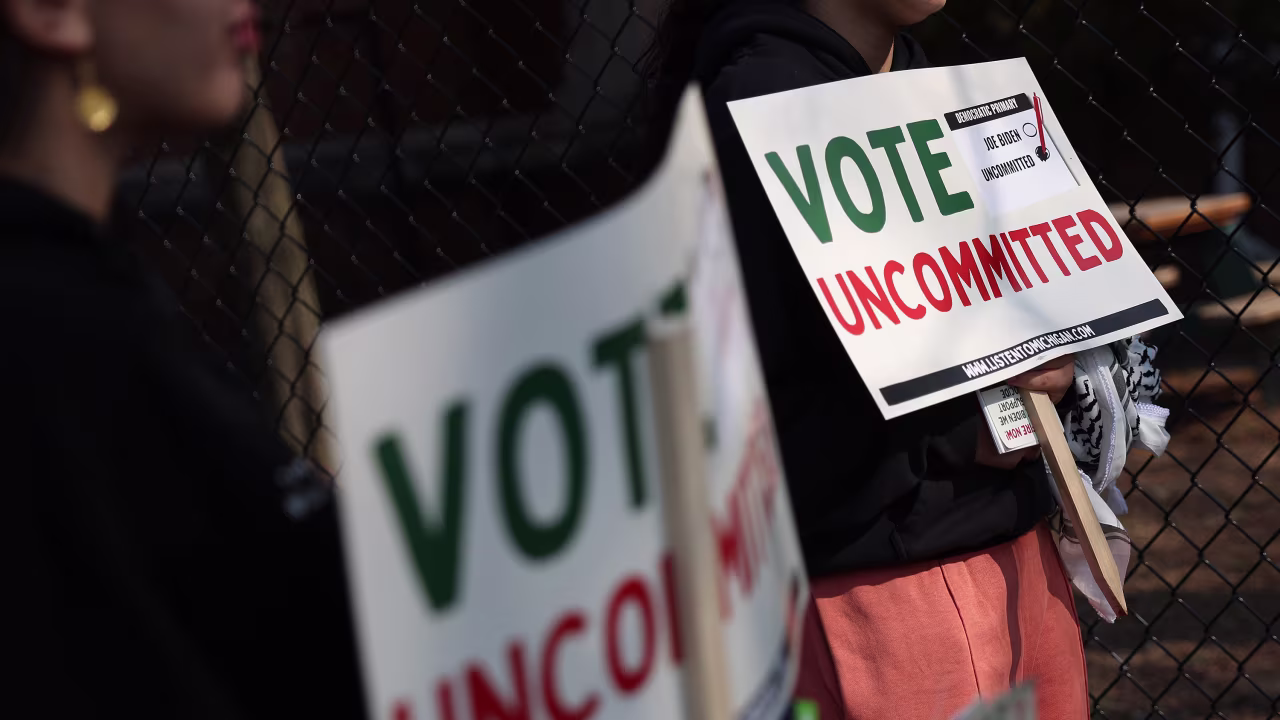 Democratic voters uncommitted to President Joe Biden rally outside a polling location during primary elections in Dearborn, Michigan, on February 27.