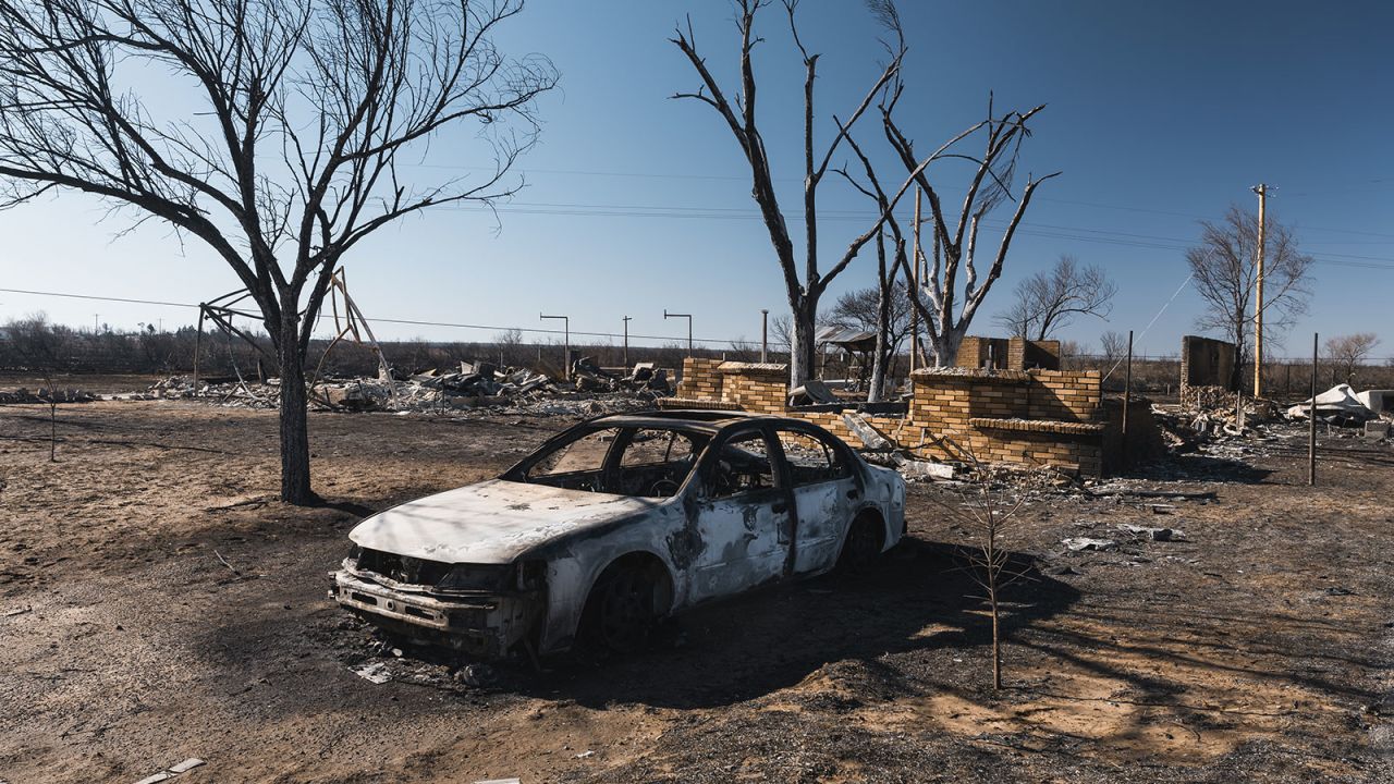A burned car and home following the Smokehouse Creek Fire in Fritch, Texas, US, on Friday, March 1, 2024. Texas GovernorÂ Greg AbbottÂ said as many as 500 structures such as houses and barns have been damaged or destroyed in the largest wildfire in state history. Photographer: Jordan Vonderhaar/Bloomberg via Getty Images