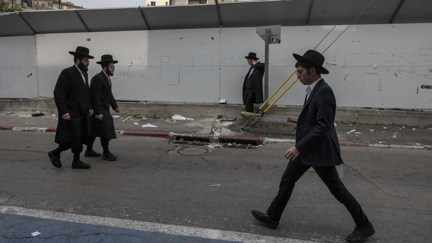 Ultra-Orthodox Jewish men walk in the central Israeli city of Bnei Brak on February 27.