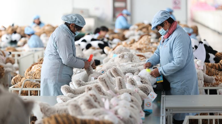 Workers at a toy export enterprise are producing plush toys for export in Lianyungang, China, on March 2, 2024.