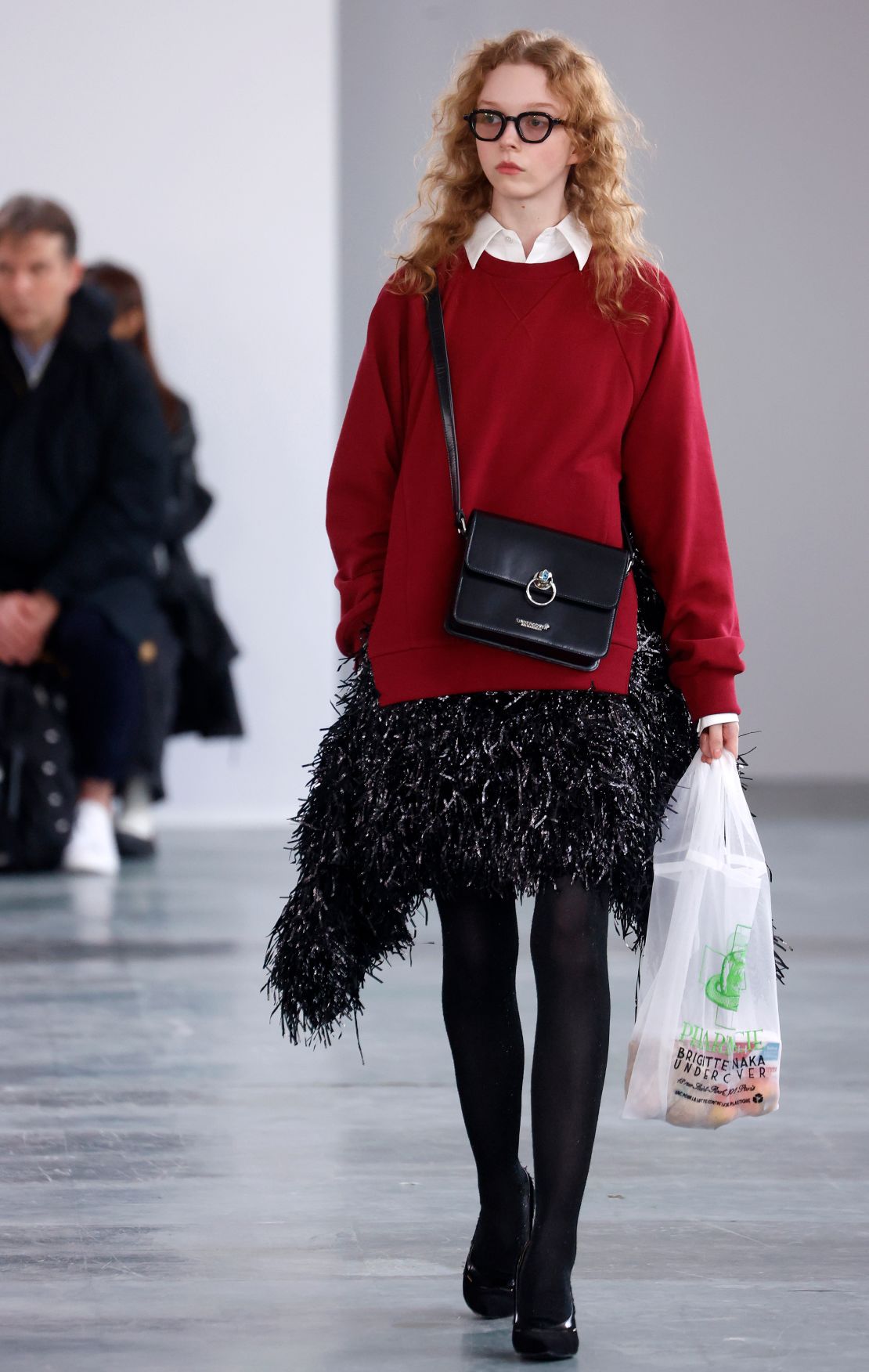 Some models at the Undercover show sported bags of groceries as a nod to the multiple roles taken on by working mothers.